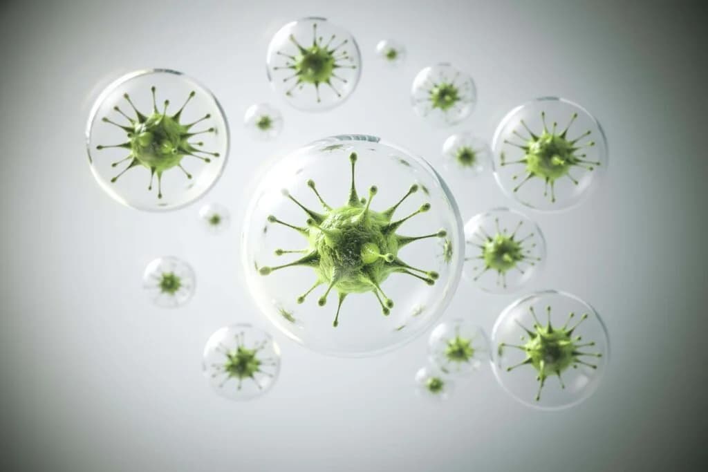 Stylised 3D rendering of green spiked bacteria suspended inside transparent bubbles